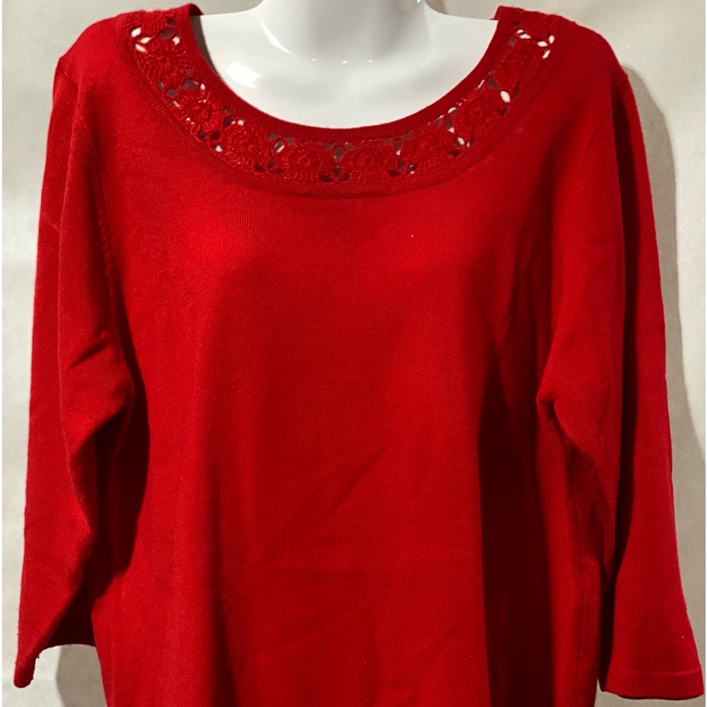 Red top  3/4 length sleeves, size large, detailing around the neck